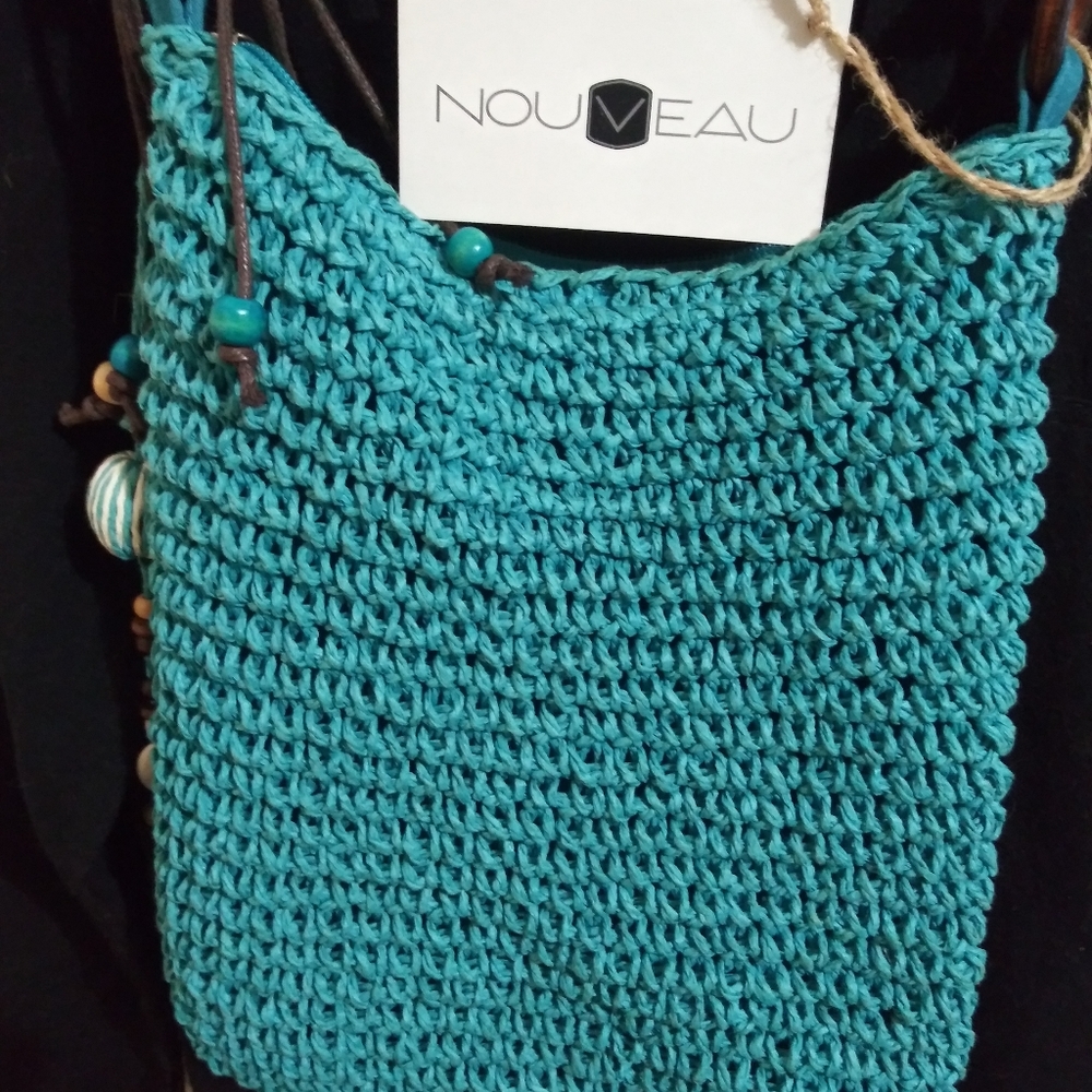 Pre-owned Nouveau blue beach hand bag in good condition.